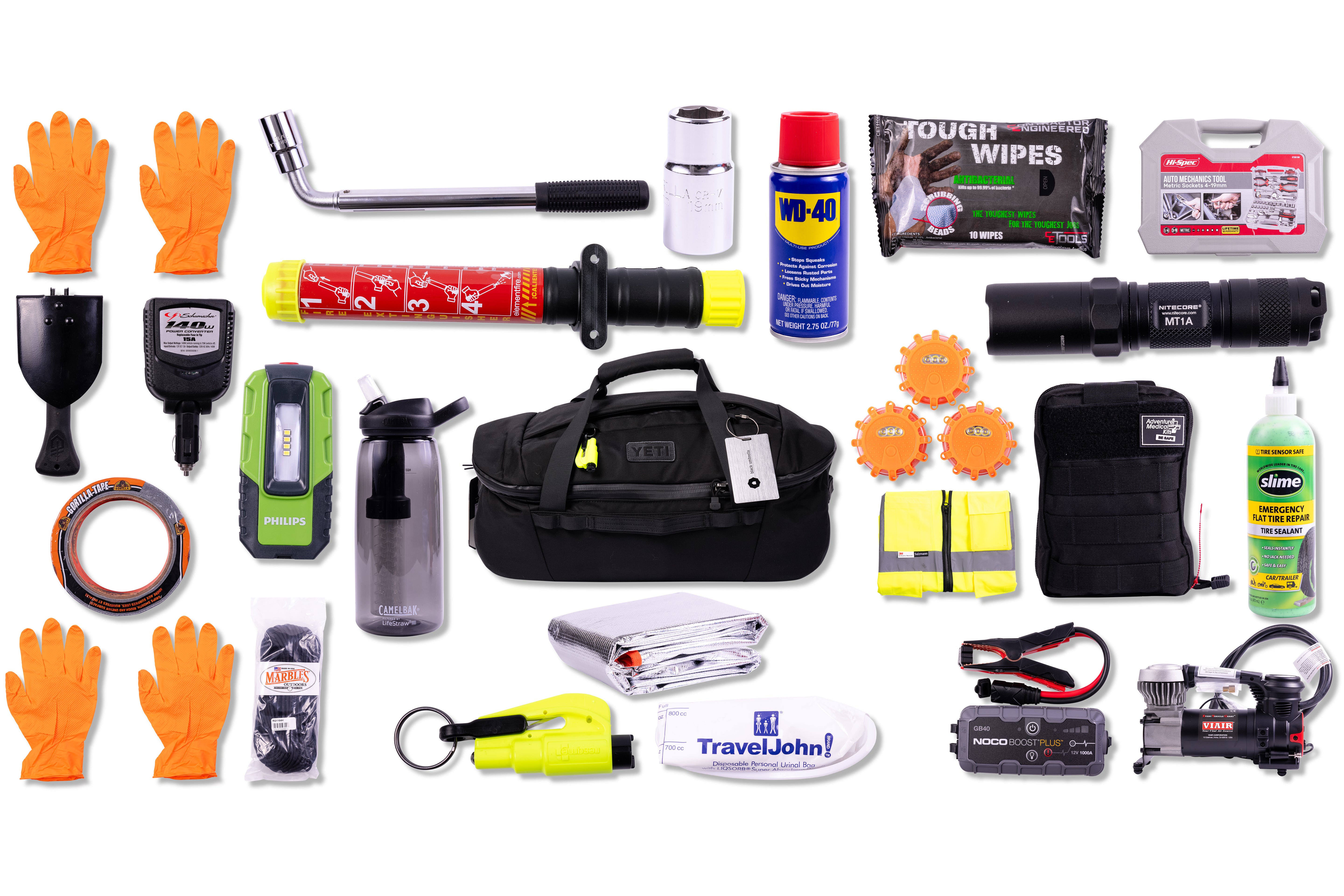 Collection of emergency survival gear including gloves, tools, and first aid supplies on a white background.